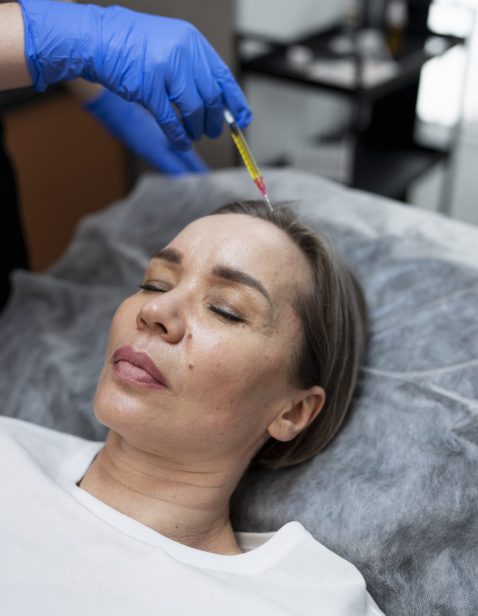 high-angle-woman-getting-prp-treatment